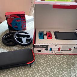 Nintendo Switch 32GB
Works perfectly, it is in great condition 
Also included: racing wheels and a travel case