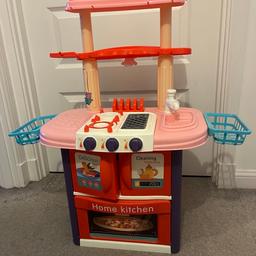 Kids kitchen with some accessories. Daughter too old for it now.
