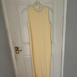 A long, skin tight yellow dress, perfect for summer time!