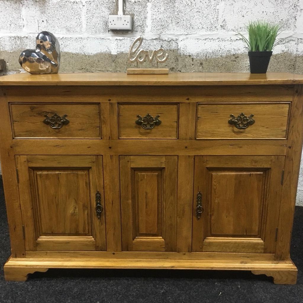 Beautiful solid oak sideboard, a quality piece of heavy furniture made to a really high standard. 3 x dovetail storage drawers in the top with ornate metal handles and a large cupboard at the bottom with shelf inside. Must be seen to be appreciated, a stunning piece of furniture. The unit measures 130cm long x 49cm deep x 90cm tall. Viewing/collection is Leeds LS24 & delivery is available if required - £275