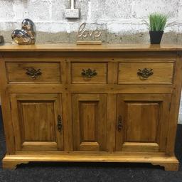 Beautiful solid oak sideboard, a quality piece of heavy furniture made to a really high standard. 3 x dovetail storage drawers in the top with ornate metal handles and a large cupboard at the bottom with shelf inside. Must be seen to be appreciated, a stunning piece of furniture. The unit measures 130cm long x 49cm deep x 90cm tall. Viewing/collection is Leeds LS24 & delivery is available if required - £275