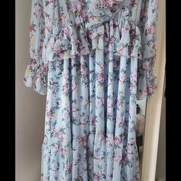 Zara floral dress
Sky blue with touches of pink, lilac and yellow flowers.
Ruffle tiered long dress
Size M
In immaculate condition, worn once at an occasion. Like New, no imperfections.