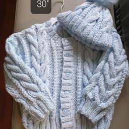DESIGN Z ARAN Blue
4/5 yr 30" Boys please ask for your colour bigger sizes to order check sizes beĺow

Deposit £5 Time of Order non Refundable
Order your Colour Size for boy or girĺ
Check if in stock
SIZES BELOW

Crew Neck Cardigan Hat pom pom
0/3m C20" L9" Sl 6" £15
6/9m C22" L10" Sl 7" £16
1/2 yr C24" L11" Sl 8" £17
2/3 yr C26" L1 2" Sl 9" £19
3/4 yr C28" L13"Sl 10" £20
4/5yr C30" L14" Sl 11" £23
HATS ONLY
Hats 20" 22" £6.50
Hats 24"26"28" £7.50
Postage will be £3.20 Check out my other Hand knitted items on sale.