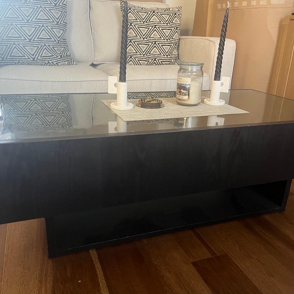 Coffee table with Glass top and side draws. Underneath storage. Recently moved in and no longer fits our space