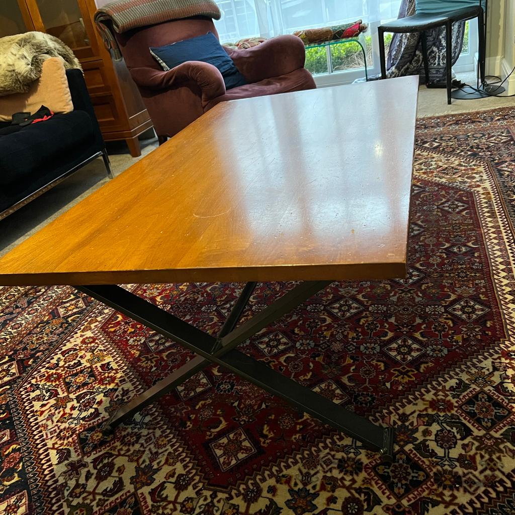 Large attractive coffee table. Hard-wood top with substantial wrought-iron "cross-over" legs.

122cm long, 88cm wide and 43cm tall.

Originally bought from John Lewis.

Must be collected from Didsbury in South Manchester.