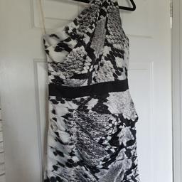 Lipsy dress, size 14 ( but a small 14 ) 
short with over one shoulder effect, size zip 
in good condition from non smoking home