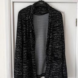 Soft stretchy comfy fabric.waffle effect textured look.black with white fleck.long arm length.hangs edge to edge.size 12.from New Look in very good condition