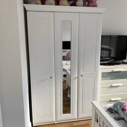 3 door mirror wardrobe, on wheels, comes fully assembled, CANNOT be disassembled. You will need to transport this in a large van.
Very good condition.
Top frame is easily removable.
Plenty of storage space.
191cm x 122cm x 56cm

NO TIME WASTERS PLEASE