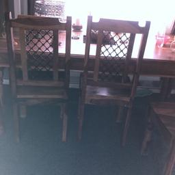 Solid oak table with 6 chairs iron decoration in middle and on chairs £500 Ono needs to be collected by 3rd April