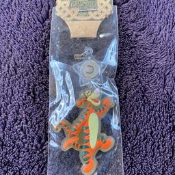 This handmade Tigger (Pooh) rubber charm is a must-have for any fan of the lovable character. The orange charm features Tigger in his classic pose, bouncing happily. It is made of high-quality rubber and is perfect for adding to your collection or attaching to your keys.

The charm is designed with collectors in mind and will make a great addition to any collection. It is an ideal gift for any fan of the classic Disney character. The Tigger charm is crafted with care and attention to detail, so you can be assured of its quality. Add some fun and character to your collection with this Tigger (Pooh) Rubber Charm.

This has been hanging around for a very long time in a drawer so the packaging isn’t perfect