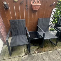 Set of two black rocking chairs with a small table for outdoor use. Been in the garden but never really used.