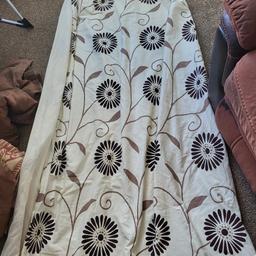 A pair of printed curtains for the living room for sale.In good condition. measurements 72 inch drop and 80 inches width. lining and hooks included.