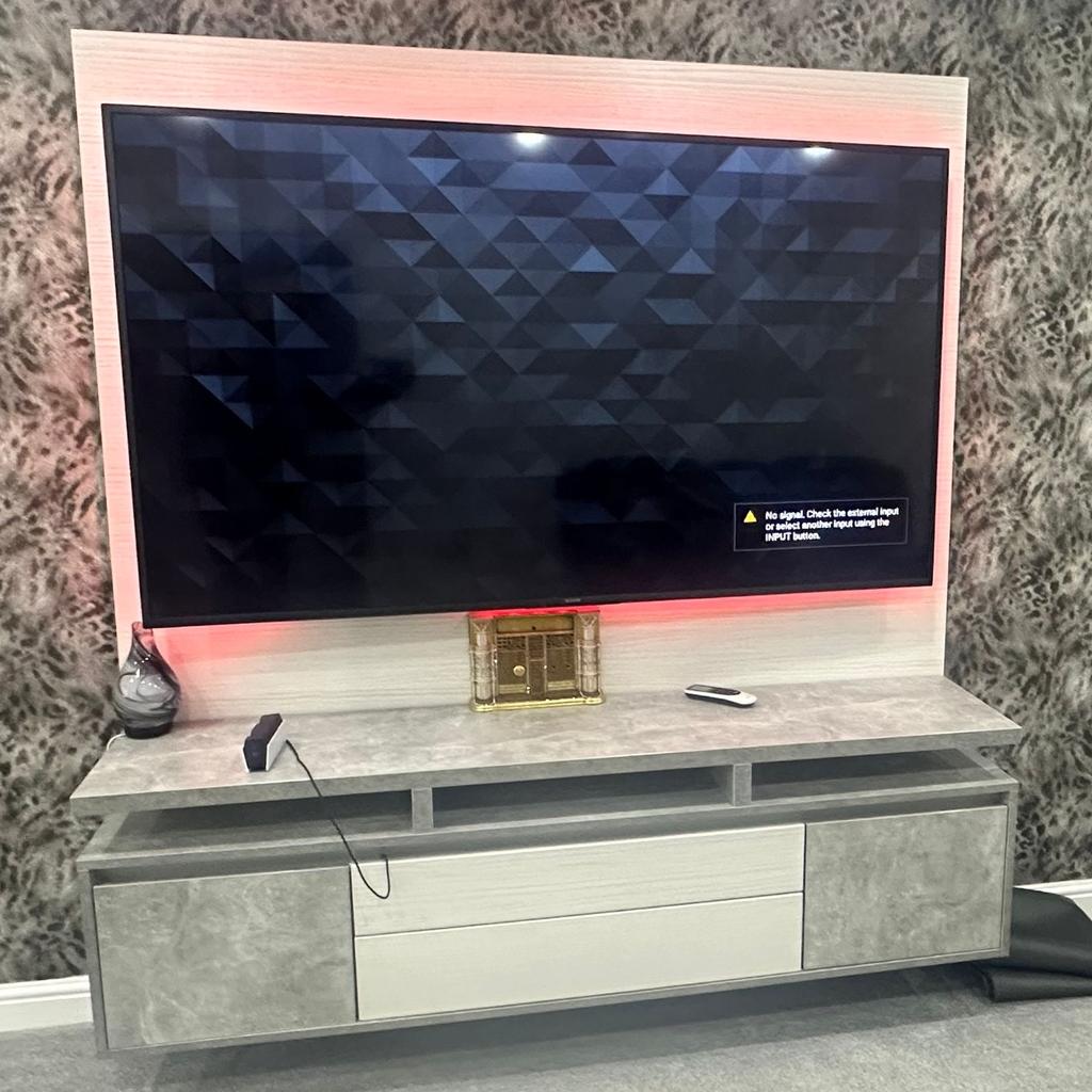 Media wall unit, immaculate condition, just 6 months old. Currently have a 75” tv as seen on picture on the unit, tv not for sale just the unit. Comes with LED lights. Paid over £1,800 will accept decent offers in the region of £700. Buyer must bring own joinery to remove