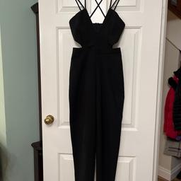 Black strappy, tapered leg jumpsuit, with cut out sides and back zip, size 6 by Missguided.
Fab condition as only worn once.