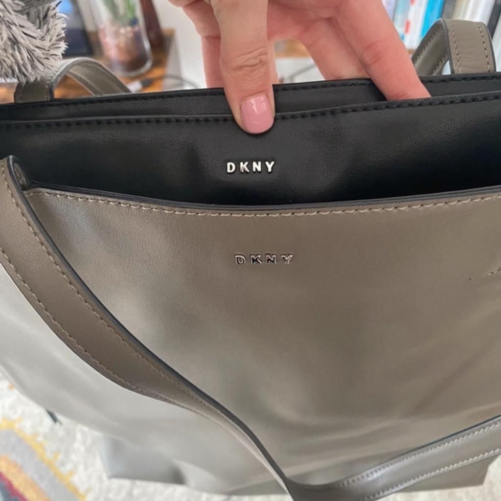 Never used leather DKNY bag. Great for 15inch laptops.