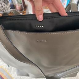 Never used leather DKNY bag. Great for 15inch laptops.