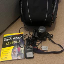 This is a canon EOS rebel T1i/500D camera plus a how to use book, a battery charger, an extra battery and a camera bag to carry it all in.