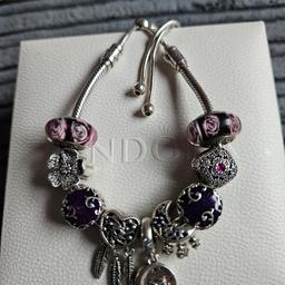 This bracelet is the one that slides. This is a genuine pandora bracelet and the charms are genuine pandora. I am not selling the charms separately. Collection only.