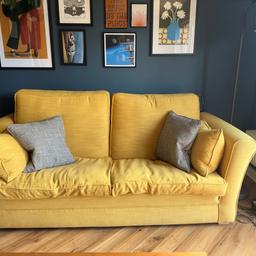 Really comfy barker & stonehouse mustard sofa with pattern pillows