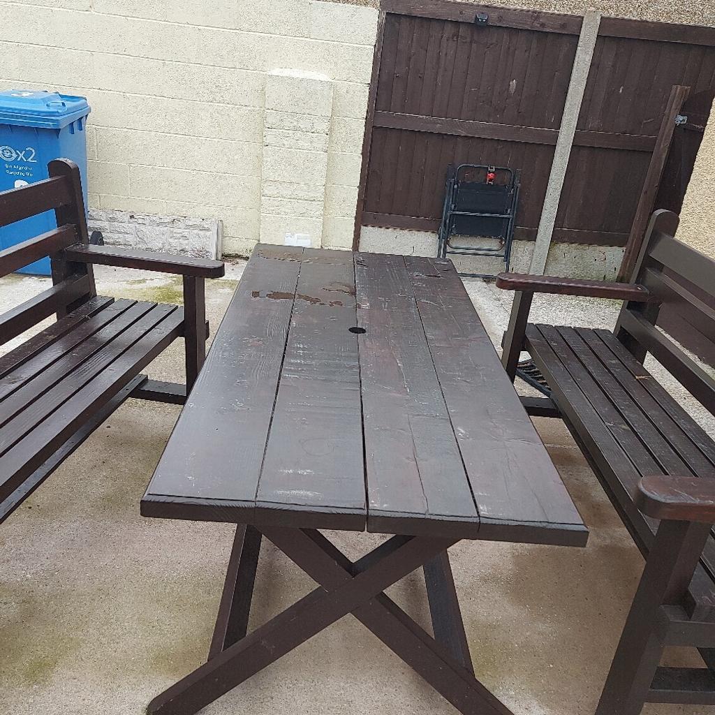 Garden wooden heavy duty outside garden table is 5ft long two benches 5ft long in fair condition been oil wax painted I am in rhyl cash when pick up asking 175 u will need a big van to pick up
