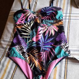 A brand new tropical swimsuits with its tags ,,beautiful patten and colourful..Size 14   PayPal or bank transfer or collection only postage  is £2.20