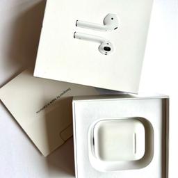 White AirPods with charging case, in original box. Model A1602. Bought October 2021. Slight scratching and discolouration to the case commensurate with age. Full working order.
