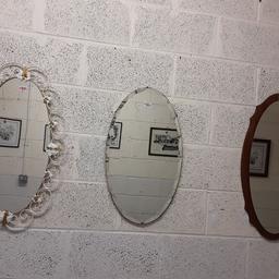 Vintage oval mirrors  £20 EACH.

The mirror on the left with the white metal is 17.5 inches long x 29 inches wide.
The one in the middle which has slight damage to the glass in places is 26 inches long x 15 inches wide.
The wooden one is 29.5 inches long x 15 inches deep.

Our second hand furniture mill shop is LOW COST MOVES, at St Paul's trading estate, Copley Mill, off Huddersfield Road, Stalybridge SK15 3DN... Delivery available for an extra charge.

There are some large metal gates next to St Paul's church... Go through them, bear immediate left and we are at the bottom of the slope, up from the red steps... 

If you are interested in this or any other item, please contact me on 07734 330574, or on the shop 0161 879 9365...Many thanks, Helen. 

We are OPEN Monday to Friday from 10 am - 5 pm and Saturday 10 am - 3.30 pm... CLOSED Sundays.  CLOSED Bank Holiday long weekends...