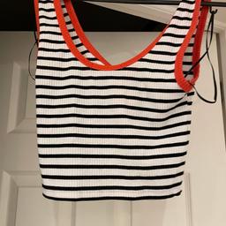 Ribbed black/white/red crop vest top
From primark 
Size 6/8
Very good condition