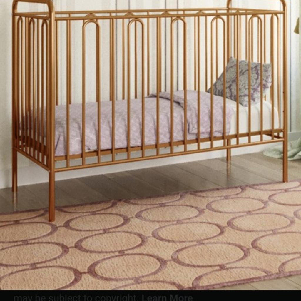 gold metal cot, by honeybee, beautiful design, unique style, lots of space, doesn't take up alot of room, cot size ( 60 x120cm)