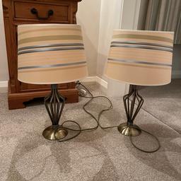 Pair of antique brass finish lamps with matching Laura Ashley shades. Shades have a beige background with olive green, cream and duck egg blue stripes. I have taken photos with and without lighting so that you are able to see the colours.