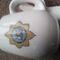 very old mug. African police dept. in good condition