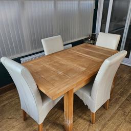 Solid Oak Table 
4 Cream leather chairs

Fully Functional and adjustable
Good condition with exceptions of all table legs which show signs of puppy chewing but could be repaired (see pics). 

Length  = 161 cm or 120 cm (with/without centre section)

Width = 90 cm

Height = 79 cm

Cash on collection only
Collection only (delivery not available)