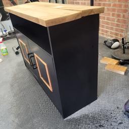 This is a black 3 shelves cupboard with wooden effect

Length 44.5 inch
Depth 15.5 inch
Height 30.5 inch

Please note there are a few marks on this