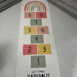 Girls hopscotch rug. In good condition but has been used and will need to be washed.