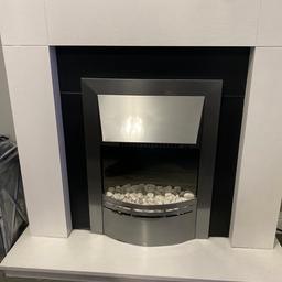 Electric fire and white wood surround with two heat settings and decorative white stones realistic looking hologram flames