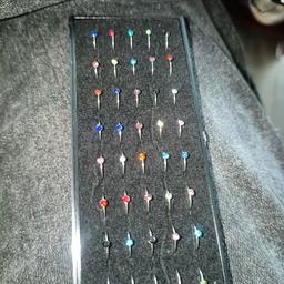These are brand new 40 PCs stainless steel nose studs.The metal is mailable so you can easily put it into place.Theres a variety of different colours.The studs are held in place with a high quality foam and covered by plastic cover.I do have a lid available But it's crack.