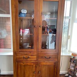 Tall wooden unit measuring 6ft 7, 3ft 3, 1ft 5. Glass doors at top with light inside, 2 draws and cupboards at bottom with shelf, needs 2 to collect heavy .