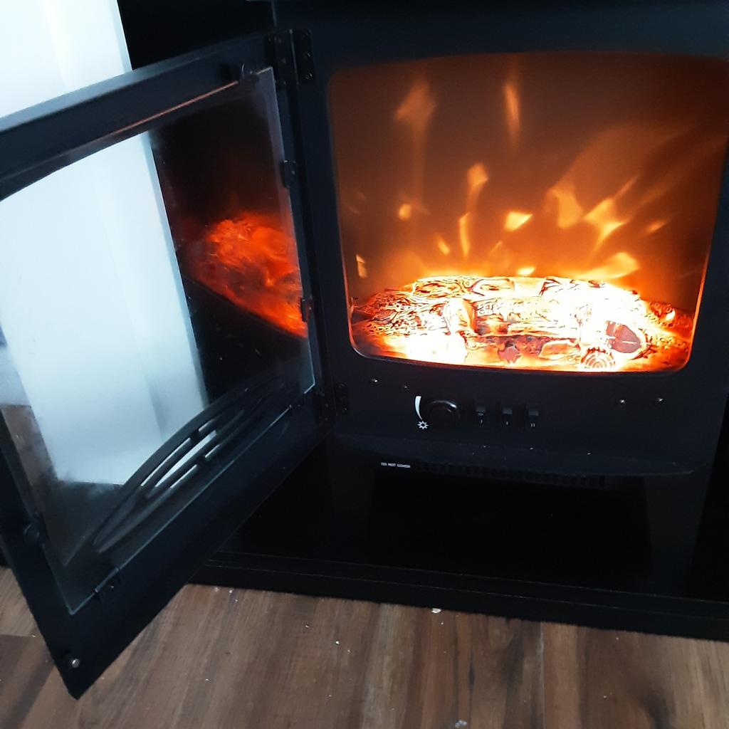 electric fire and surround in perfect condition no marks or scratches..you can turn heat off and just have effect..controls inside door..I need the extra space otherwise I would keep it ..thanks