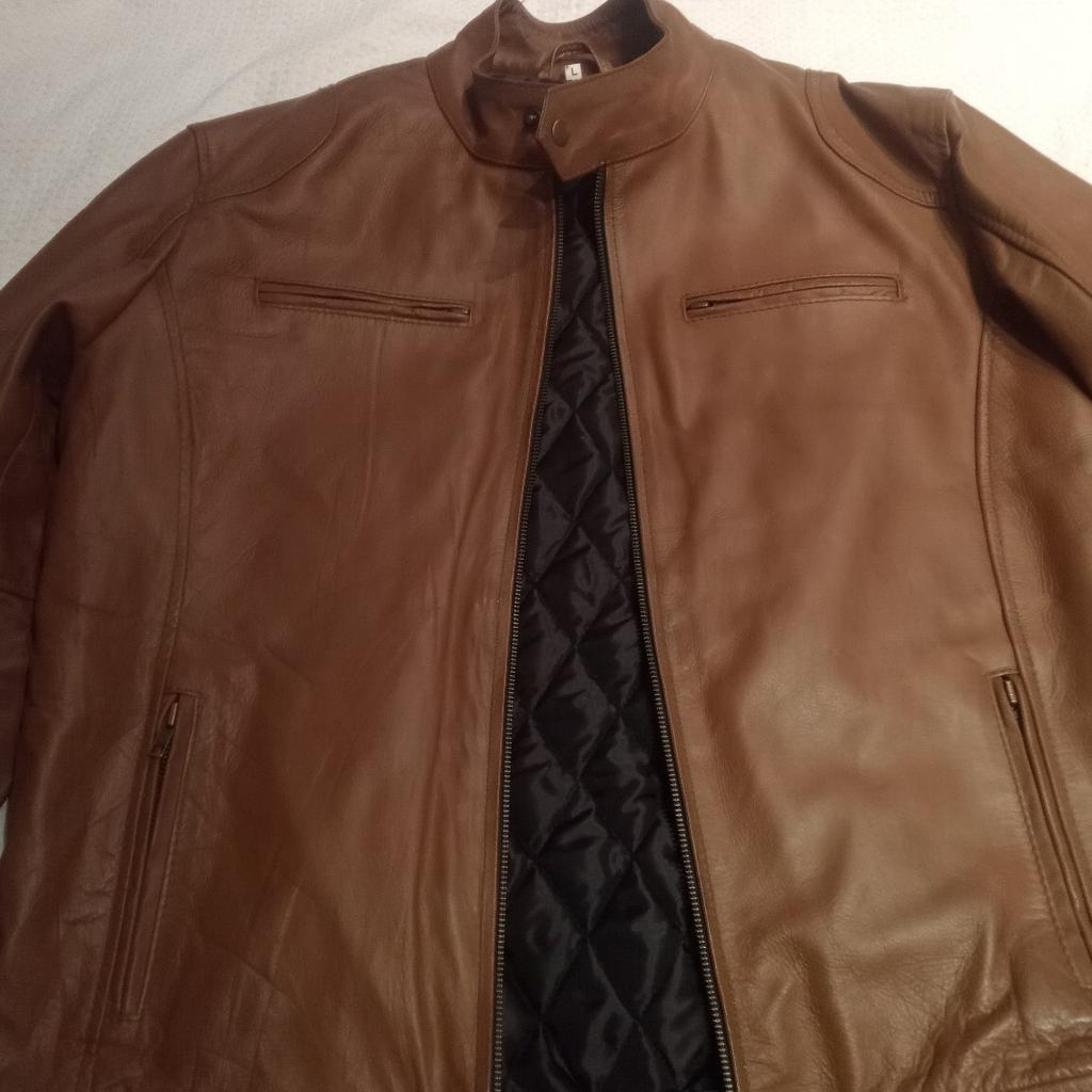 Beige brown leather Jacket Size Large
Never warn
New