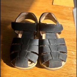In good condition although signs of wear to the bottom of one sandal easily cleaned.