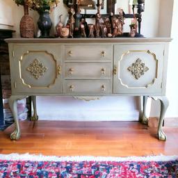 This is a lovely upcycled vintage mixed grey/sage green with gold accents large sideboard/cabinet/buffet, it would look great in any room and make a great talking piece.
 Height 97cm width 152cm depth 52 cm. 