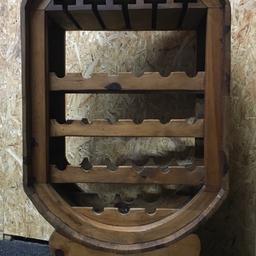 Large solid wood barrel wine rack which holds 21 bottles of wine and also has space to hang 5 rows of wine glasses at the top. Ideal for a home pub:bar. The unit measures 68cm wide x 35cm deep x 121cm tall. Viewing/collection is Leeds LS24 & delivery is available if required - £150