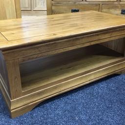Large solid oak rustic coffee table.  A really heavy piece of quality furniture with 2 x display shelves. The table measures 110cm long x 60cm wide x 47cm tall. Viewing/collection is Leeds LS24 & delivery is available if required - £165