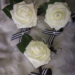 3 x cream/ivory wedding button hole flowers with black/white bow and diamond centre
individually homemade 
selling as a 3 piece or will sell individually 
I can also make more of the same on request 
collection from Sheffield s35 area 
can post p&p extra