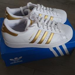 Brand new Adidas Superstar trainers.
This pair carries on the tradition with golden details that are anything but dull. Size UK 7, not an easy size to get online
Never been worn, in original box