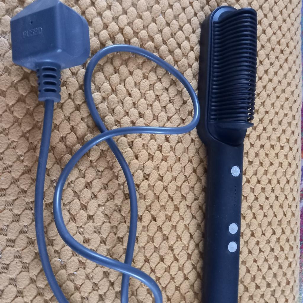 Heated metal brush that straightens long hair, variuos heat settings. Used a couple of times only