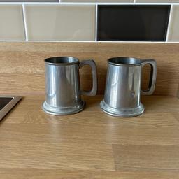 A pair of beautiful, original Pewter Tankards. Shows the signature of the bottom of each cup. Quite antique, no date printed on the bottom but my grandparents have owned these for decades. Great addition to the household, bar or just for display.