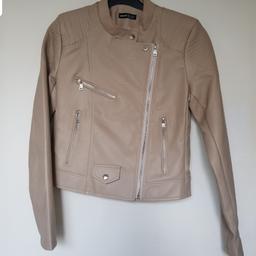 Beige Faux Leather PVC Biker Jacket.Size small.
With fake zips.

Post to England only.