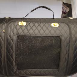 Black quilted cat Carrier
would suit small/medium sized cats or small dog.
Two end openings
One front opening
Used once
like new condition 
collection