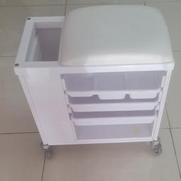 Portable pedicure trolly in white colour . Excellent condition.  Three trays . One side space to put towels in ..Nice and comfortable sitting seat as well. Ideal for pedicure or use as a stool.